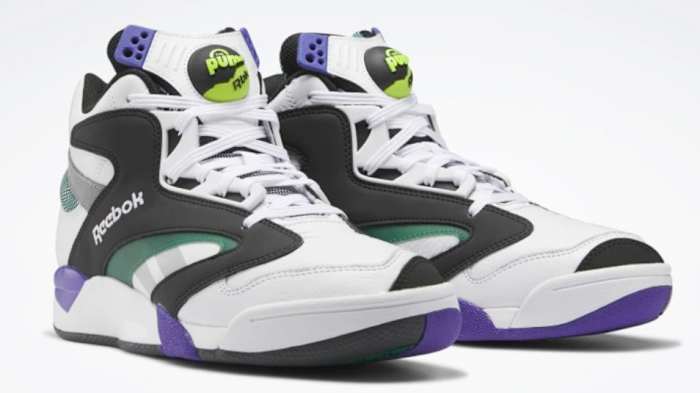 View of white, black, and purple Reebok shoes.